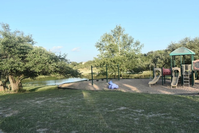 1800 Thousand Oaks Trl, Liberty Hill, TX 78642 - community play area featuring a water view and a lawn