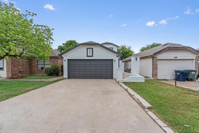 837 Mica Ln, Leander, TX 78641 - view of front facade featuring a front lawn, a garage, and brick siding
