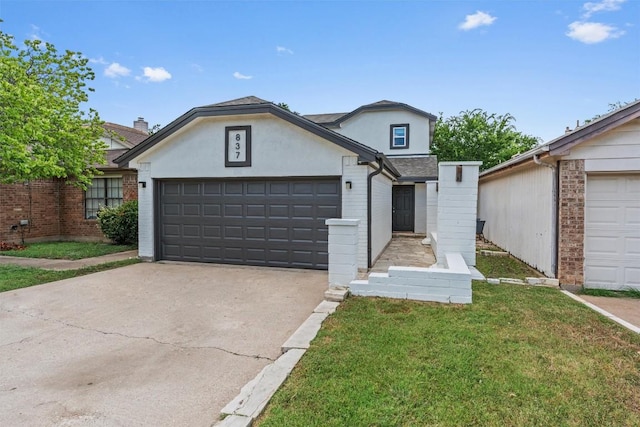 837 Mica Ln, Leander, TX 78641 - traditional-style home with a garage, driveway, stucco siding, and a front lawn