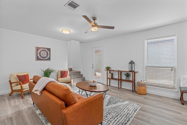 837 Mica Ln, Leander, TX 78641 - living room featuring stairs, plenty of natural light, and light wood-style flooring