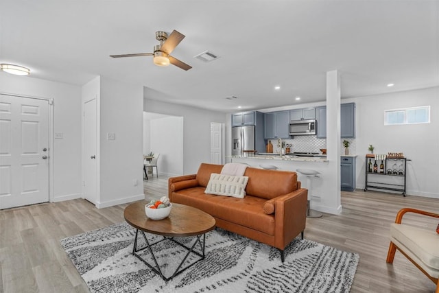 837 Mica Ln, Leander, TX 78641 - living room featuring light wood-style floors, recessed lighting, and ceiling fan