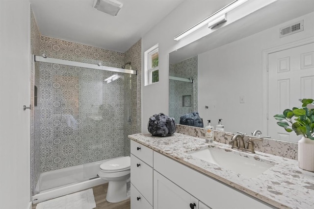 837 Mica Ln, Leander, TX 78641 - full bath with vanity, a stall shower, and wood finished floors