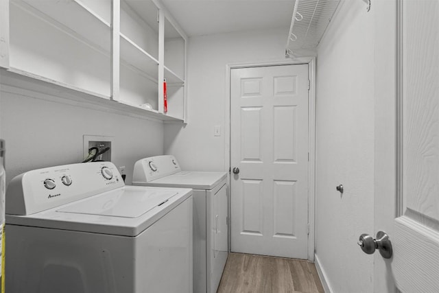 837 Mica Ln, Leander, TX 78641 - laundry room featuring washer and dryer and light wood-style flooring