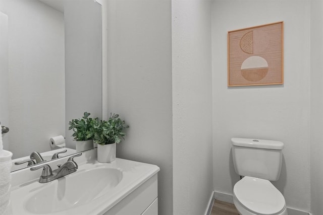 837 Mica Ln, Leander, TX 78641 - half bathroom with vanity and wood finished floors