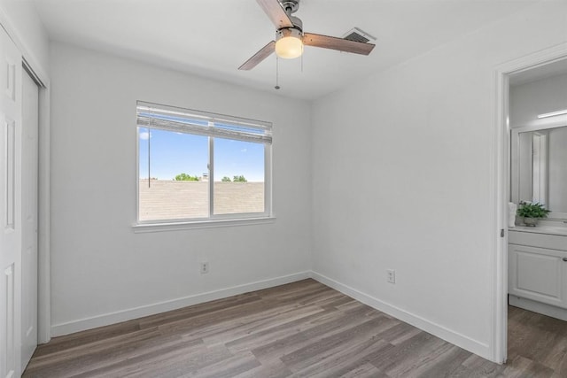 837 Mica Ln, Leander, TX 78641 - unfurnished bedroom featuring light wood-type flooring, ceiling fan, and a closet