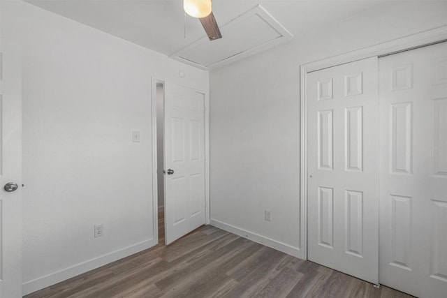 837 Mica Ln, Leander, TX 78641 - unfurnished bedroom with dark wood-style floors, a closet, attic access, and ceiling fan