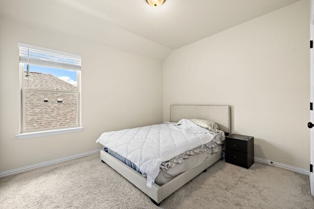 2433 Roaring River Trl, Leander, TX 78641 - carpeted bedroom featuring baseboards and vaulted ceiling