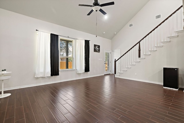 2433 Roaring River Trl, Leander, TX 78641 - unfurnished living room featuring stairway, ceiling fan, high vaulted ceiling, and dark wood-style floors