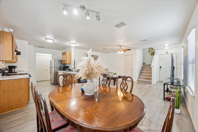 8710 Davis Oaks Trl, Austin, TX 78748 - dining area with stairway, light wood-style floors, and ceiling fan