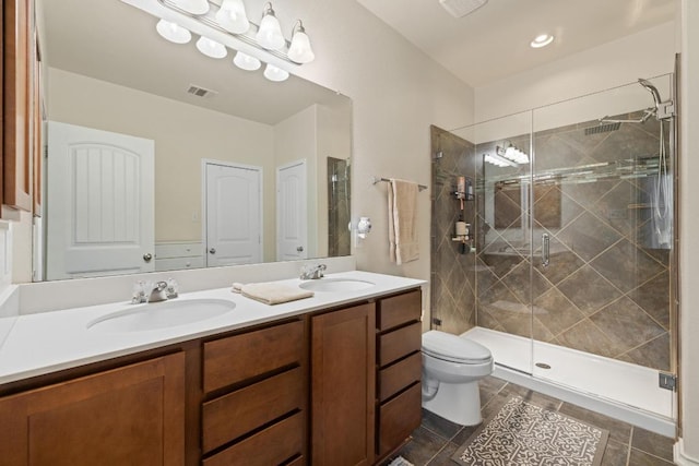 901 Water Hyacinth Loop, Leander, TX 78641 - bathroom with double vanity, a stall shower, and tile patterned flooring