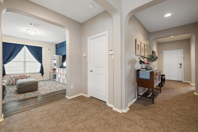 901 Water Hyacinth Loop, Leander, TX 78641 - corridor featuring arched walkways, tile patterned floors, and recessed lighting