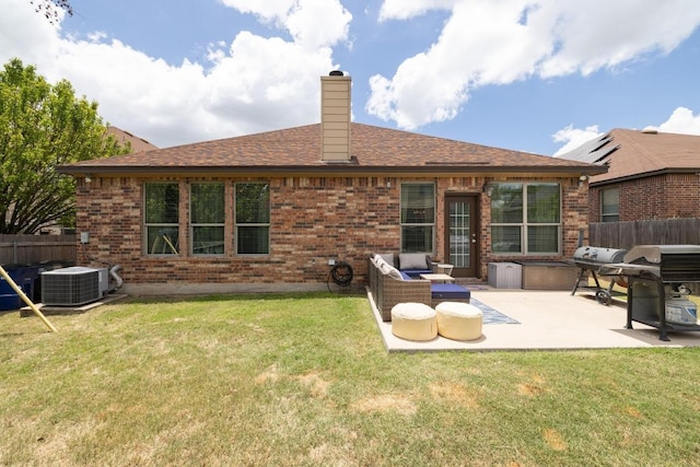 901 Water Hyacinth Loop, Leander, TX 78641 - rear view of property featuring a patio area, brick siding, a chimney, and a shingled roof