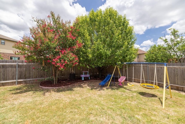 901 Water Hyacinth Loop, Leander, TX 78641 - fenced backyard with a playground