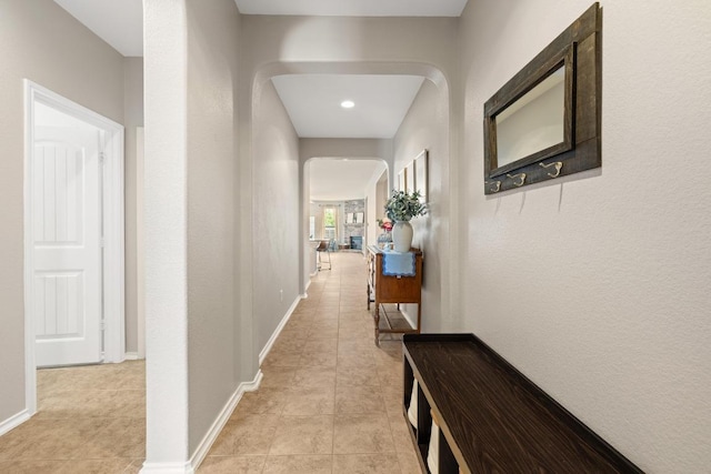 901 Water Hyacinth Loop, Leander, TX 78641 - hallway with arched walkways and light tile patterned floors