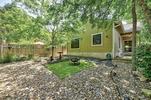 2408 Amur Dr, Austin, TX 78745 - view of yard with a fire pit