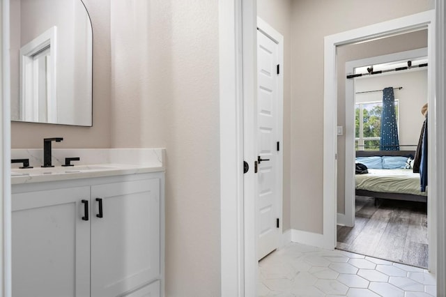 633 N Stovall Dr, Robinson, TX 76706 - ensuite bathroom with vanity and tile patterned floors