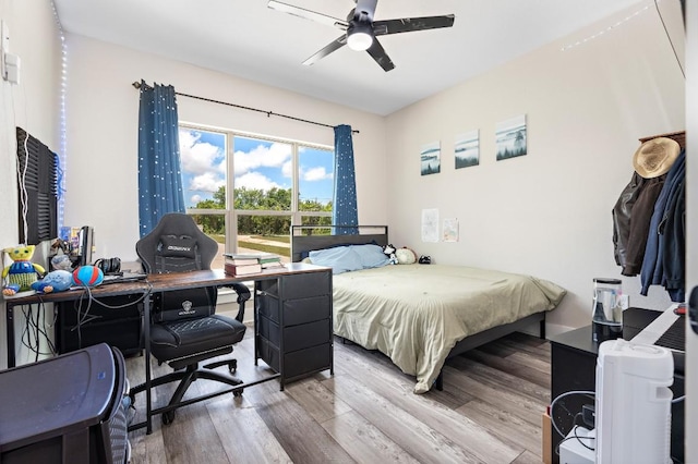 633 N Stovall Dr, Robinson, TX 76706 - bedroom featuring wood finished floors, a desk, and a ceiling fan