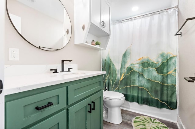633 N Stovall Dr, Robinson, TX 76706 - bathroom featuring vanity, wood finished floors, and shower / bath combination with curtain