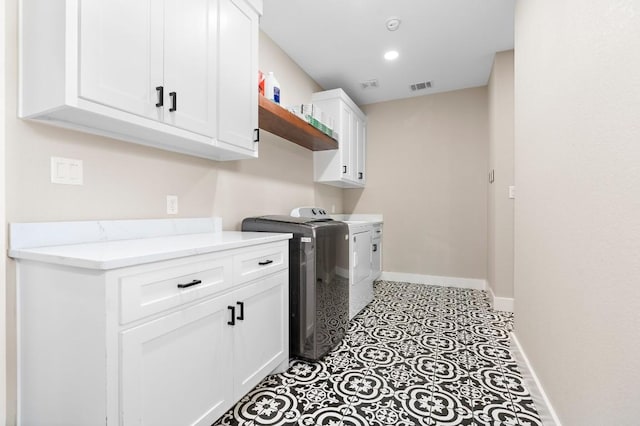 633 N Stovall Dr, Robinson, TX 76706 - laundry room featuring cabinet space and separate washer and dryer