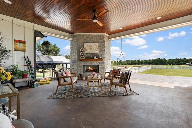 633 N Stovall Dr, Robinson, TX 76706 - view of patio featuring a ceiling fan and an outdoor living space with a fireplace
