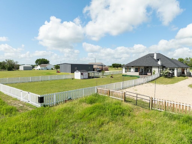 633 N Stovall Dr, Robinson, TX 76706 - fenced backyard featuring a storage shed and driveway