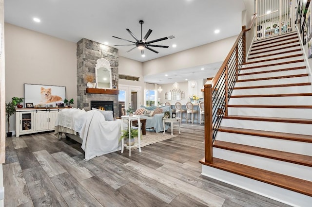 633 N Stovall Dr, Robinson, TX 76706 - living area with a fireplace, a ceiling fan, stairs, dark wood-style floors, and recessed lighting