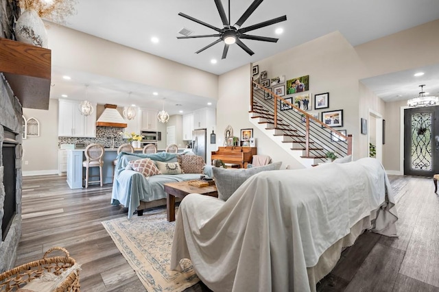 633 N Stovall Dr, Robinson, TX 76706 - living room featuring recessed lighting, stairway, a chandelier, a ceiling fan, and light wood finished floors