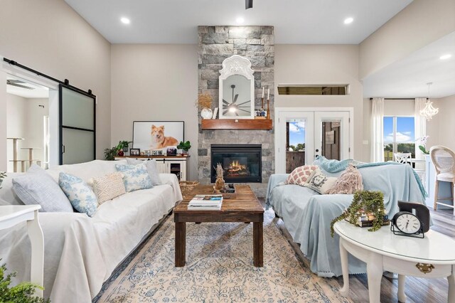 633 N Stovall Dr, Robinson, TX 76706 - living area featuring a barn door, a fireplace, recessed lighting, and wood finished floors