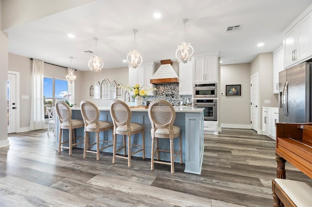 633 N Stovall Dr, Robinson, TX 76706 - kitchen featuring appliances with stainless steel finishes, a chandelier, decorative backsplash, recessed lighting, and light countertops