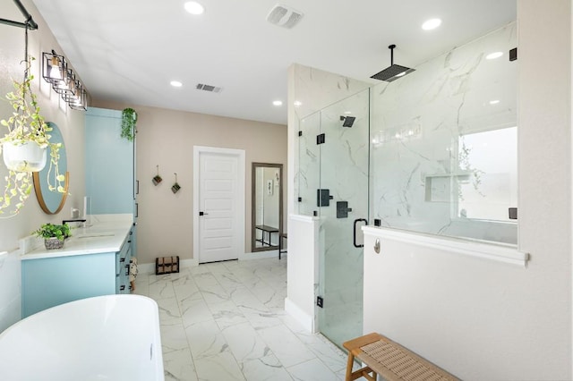 633 N Stovall Dr, Robinson, TX 76706 - full bathroom with a marble finish shower, marble look tile flooring, a freestanding tub, vanity, and recessed lighting