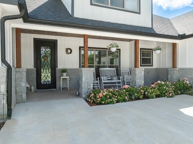 633 N Stovall Dr, Robinson, TX 76706 - property entrance with covered porch, board and batten siding, and stone siding