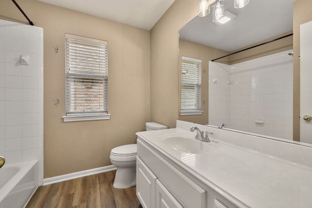 2604 Zambia Dr, Cedar Park, TX 78613 - full bath featuring wood finished floors, vanity, plenty of natural light, and bathing tub / shower combination