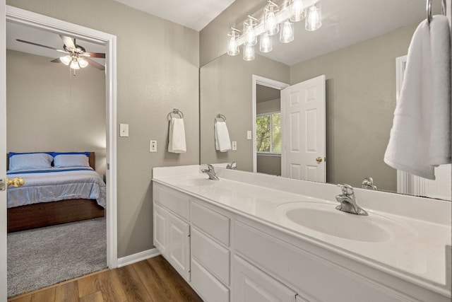 2604 Zambia Dr, Cedar Park, TX 78613 - full bathroom with wood finished floors, double vanity, ensuite bath, and a ceiling fan