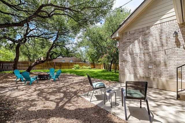 2604 Zambia Dr, Cedar Park, TX 78613 - fenced backyard featuring a fire pit and a patio area