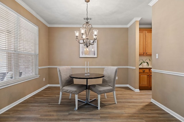 2604 Zambia Dr, Cedar Park, TX 78613 - dining room with a chandelier, wood finished floors, and ornamental molding