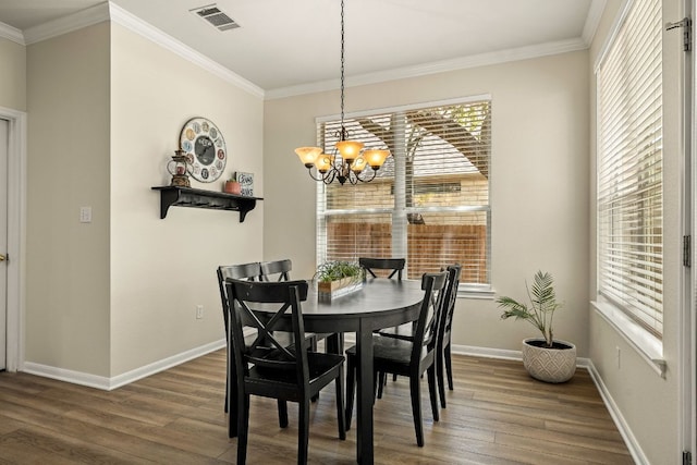 2604 Zambia Dr, Cedar Park, TX 78613 - dining space with wood finished floors, a chandelier, plenty of natural light, and ornamental molding