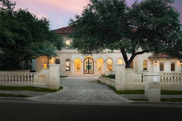 2005 Far Gallant Dr, Austin, TX 78746 - mediterranean / spanish house with decorative driveway and a fenced front yard