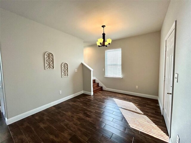 3805 E US-290 Hwy E, Paige, TX 78659 - spare room with a chandelier, dark wood-style floors, and stairs