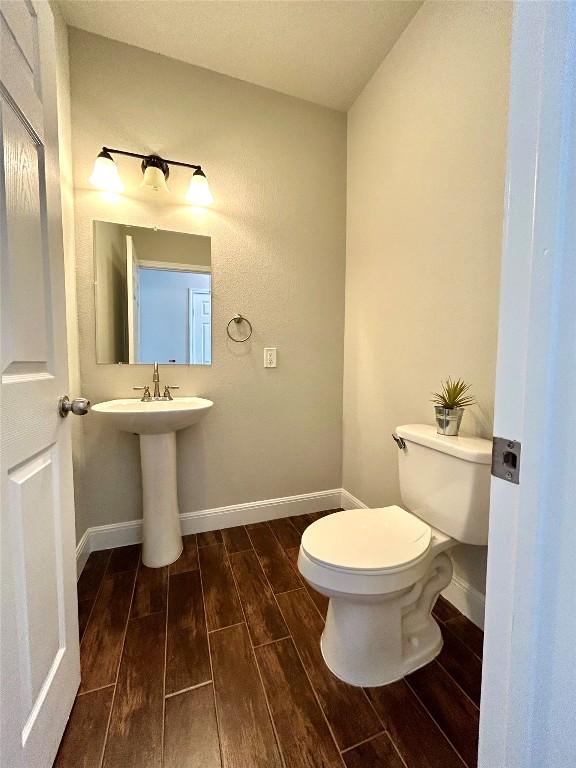 3805 E US-290 Hwy E, Paige, TX 78659 - half bath with wood tiled floors and toilet