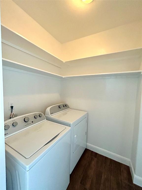 3805 E US-290 Hwy E, Paige, TX 78659 - washroom with separate washer and dryer and dark wood finished floors