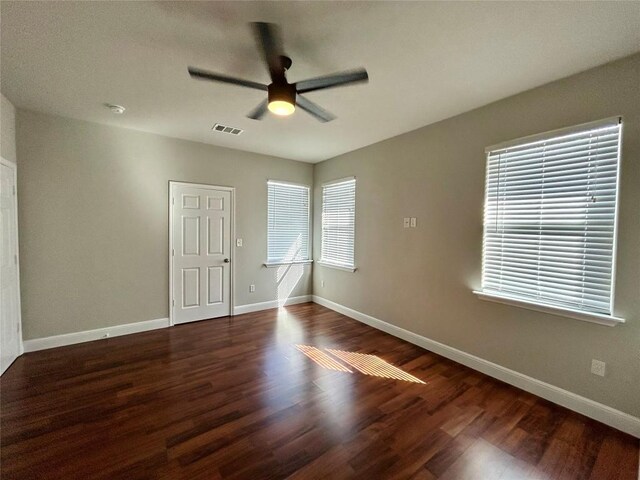 3805 E US-290 Hwy E, Paige, TX 78659 - spare room featuring a ceiling fan, wood finished floors, and a smoke detector