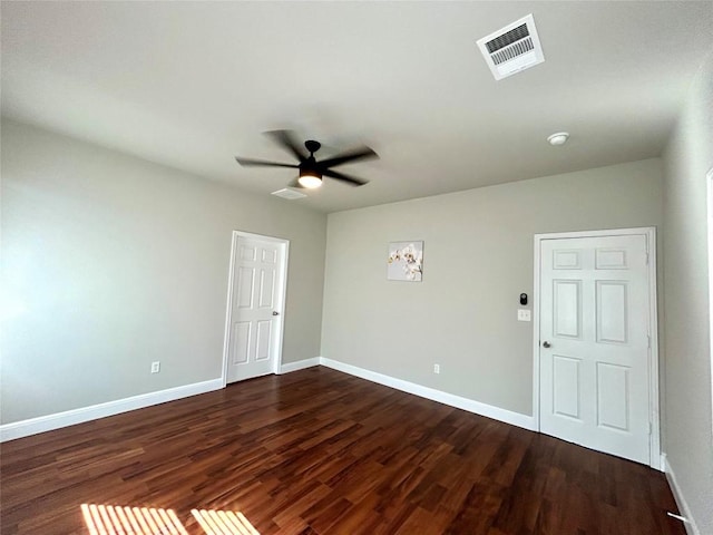 3805 E US-290 Hwy E, Paige, TX 78659 - unfurnished room featuring ceiling fan, dark wood-style floors, and a smoke detector