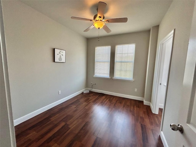 3805 E US-290 Hwy E, Paige, TX 78659 - unfurnished bedroom with dark wood-style floors and ceiling fan