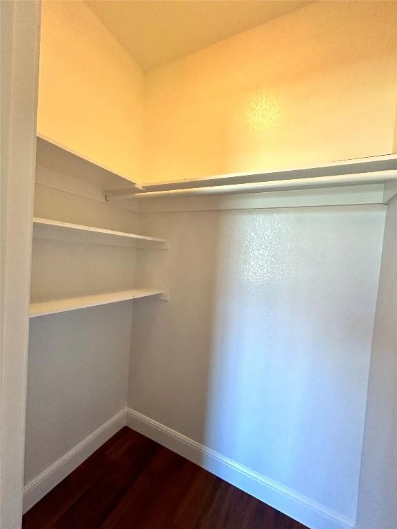 3805 E US-290 Hwy E, Paige, TX 78659 - walk in closet with dark wood-style floors