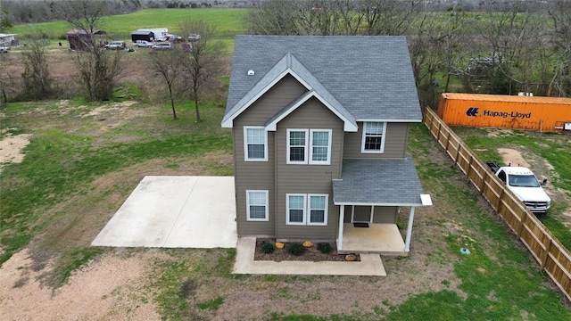 3805 E US-290 Hwy E, Paige, TX 78659 - rear view of property featuring a shingled roof and a patio