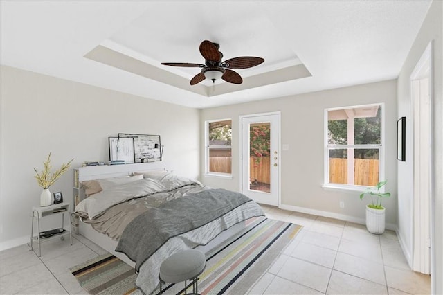 1804 Fairweather Way, Cedar Park, TX 78613 - bedroom with a raised ceiling, multiple windows, and light tile patterned floors