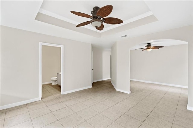 1804 Fairweather Way, Cedar Park, TX 78613 - unfurnished room with a tray ceiling, a ceiling fan, and arched walkways