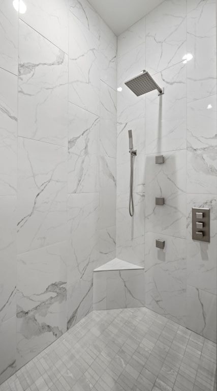 311 Out Crop, Horseshoe Bay, TX 78657 - full bathroom with a marble finish shower
