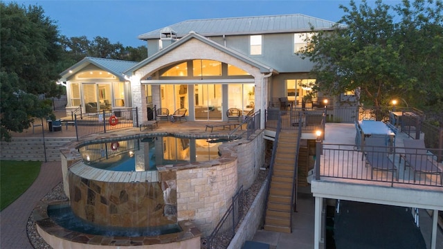 3000 Driftwood Ln, Horseshoe Bay, TX 78657 - rear view of house featuring a patio, stairs, a metal roof, and stucco siding