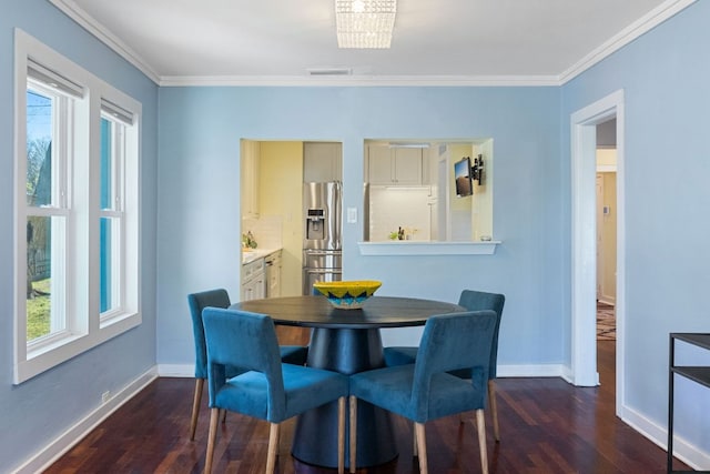 4419 Sinclair Ave, Austin, TX 78756 - dining space with dark wood-style flooring and crown molding